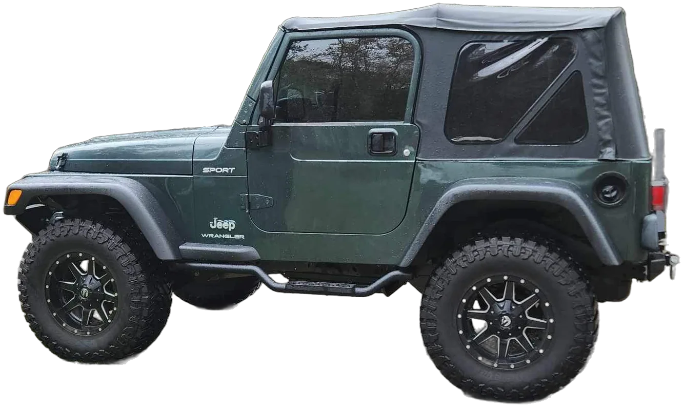 A green Jeep Wrangler Sport with a soft top and off-road tires